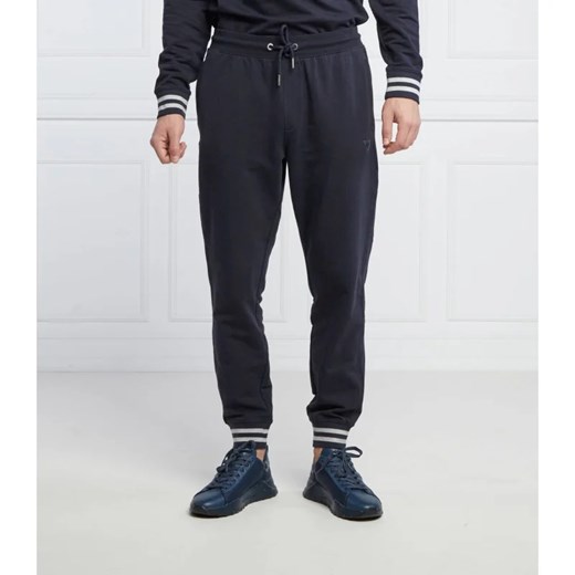 GUESS Spodnie dresowe Adam | Relaxed fit ze sklepu Gomez Fashion Store w kategorii Spodnie męskie - zdjęcie 164335515