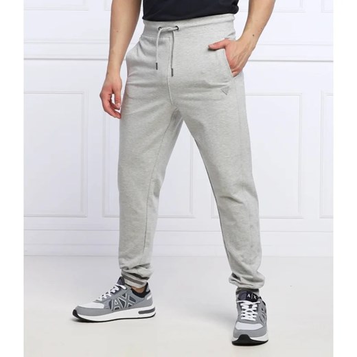 GUESS Spodnie dresowe Adam | Relaxed fit ze sklepu Gomez Fashion Store w kategorii Spodnie męskie - zdjęcie 164337948