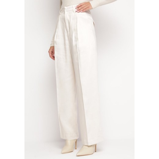 Jasnobeżowe Szerokie Spodnie z Kieszeniami Zapinane na Haftkę Tuzette ze sklepu Born2be Odzież w kategorii Spodnie damskie - zdjęcie 165702219