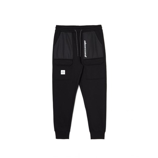 Cropp - Czarne dresowe joggery z efektem reflective - czarny ze sklepu Cropp w kategorii Spodnie męskie - zdjęcie 166212865