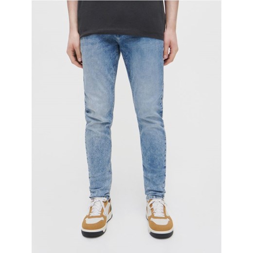 Jeansy slim fit z efektem sprania niebieskie House 29/32 House