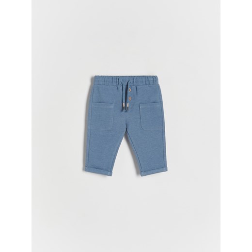 Reserved - Dzianinowe spodnie z kieszeniami - niebieski ze sklepu Reserved w kategorii Spodnie i półśpiochy - zdjęcie 166990235