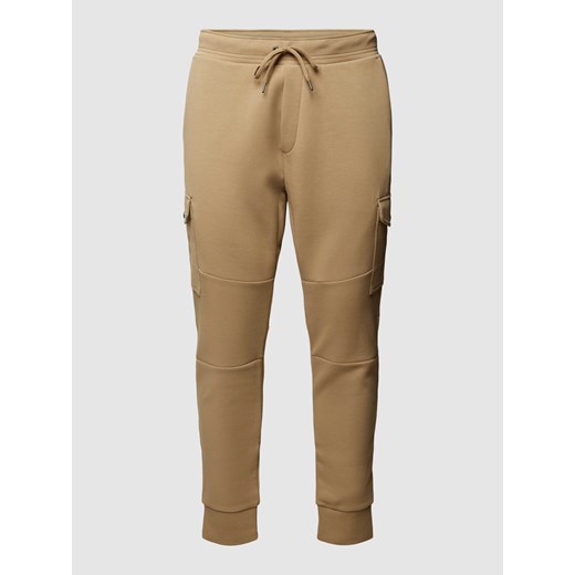 Spodnie dresowe z detalem z logo w jednolitym kolorze ze sklepu Peek&Cloppenburg  w kategorii Spodnie męskie - zdjęcie 167933265