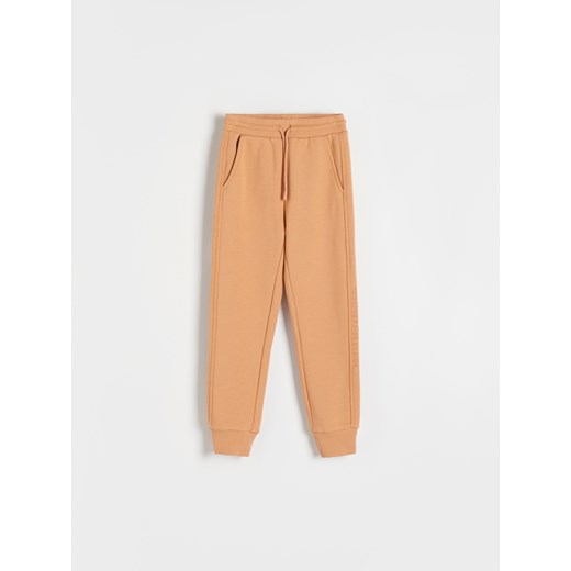 Reserved - Spodnie dresowe z bawełną - beżowy ze sklepu Reserved w kategorii Spodnie dziewczęce - zdjęcie 167947185