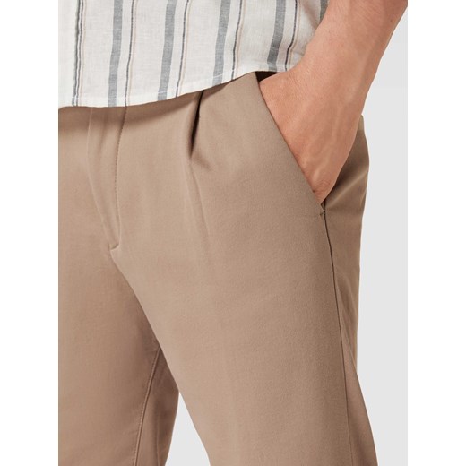 Spodnie z bocznymi,wpuszczanymi kieszeniami model ‘CHASY’ Drykorn 33/32 wyprzedaż Peek&Cloppenburg 