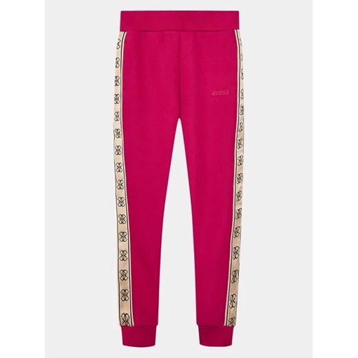 Guess Spodnie dresowe J2YQ27 KB3P2 Różowy Regular Fit ze sklepu MODIVO w kategorii Spodnie dziewczęce - zdjęcie 168395808