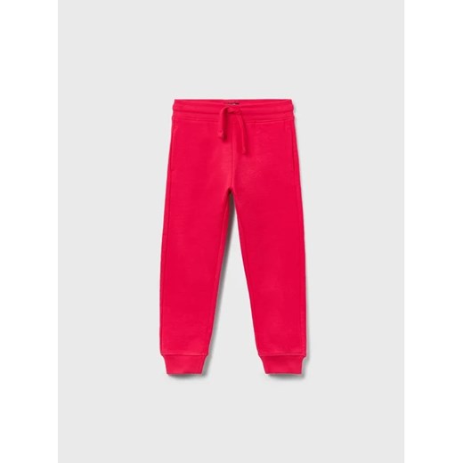 OVS Spodnie dresowe 1593672 Różowy Regular Fit ze sklepu MODIVO w kategorii Spodnie dziewczęce - zdjęcie 168417835