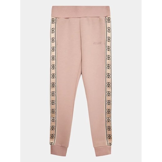 Guess Spodnie dresowe J2YQ27 KB3P2 Beżowy Relaxed Fit Guess 12Y MODIVO