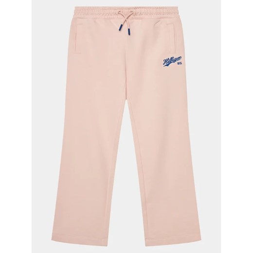 Tommy Hilfiger Spodnie dresowe Hilfiger Script Wide Sweatpant KG0KG07751 Różowy Regular Fit ze sklepu MODIVO w kategorii Spodnie dziewczęce - zdjęcie 168447538