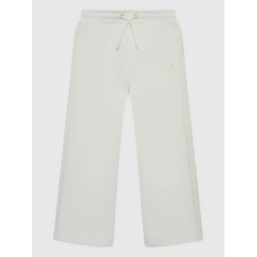 Guess Spodnie dresowe J2YQ26 FL03S Biały Regular Fit Guess 16Y wyprzedaż MODIVO
