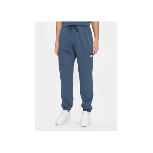 Reebok Spodnie dresowe Archive Essentials IM1526 Niebieski Regular Fit ze sklepu MODIVO w kategorii Spodnie męskie - zdjęcie 168505119