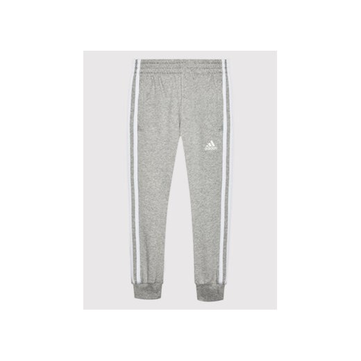 adidas Spodnie dresowe Essentials H65793 Szary Standard Fit ze sklepu MODIVO w kategorii Spodnie dziewczęce - zdjęcie 168507407