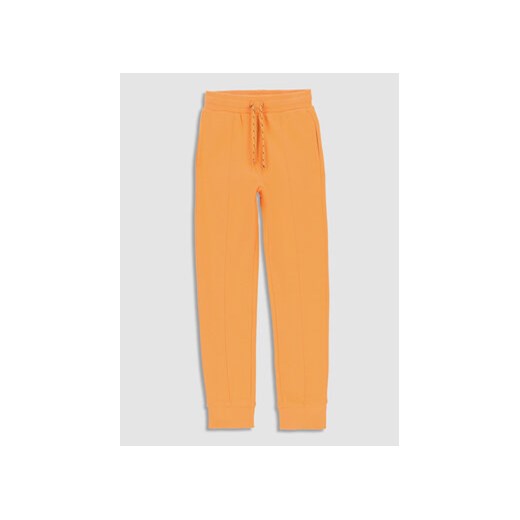 Coccodrillo Spodnie dresowe WC3120101DRK Pomarańczowy Regular Fit ze sklepu MODIVO w kategorii Spodnie dziewczęce - zdjęcie 168508358