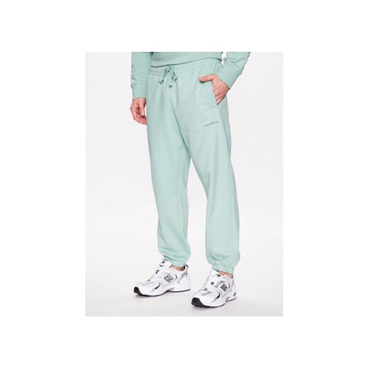New Balance Spodnie dresowe MP23551 Zielony Relaxed Fit ze sklepu MODIVO w kategorii Spodnie męskie - zdjęcie 168510276