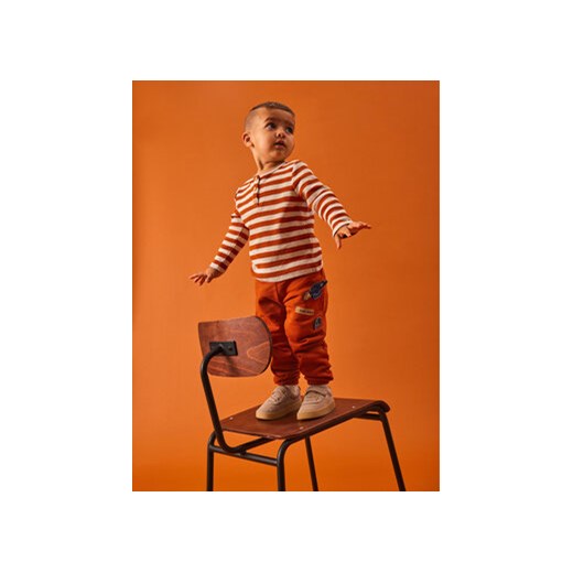 NAME IT Spodnie dresowe 13221577 Pomarańczowy Regular Fit ze sklepu MODIVO w kategorii Spodnie chłopięce - zdjęcie 168515738
