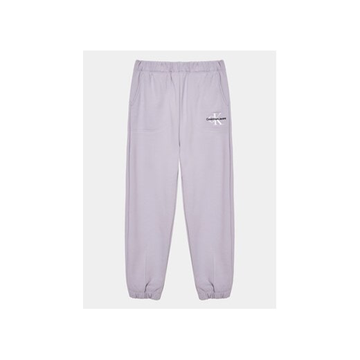 Calvin Klein Jeans Spodnie dresowe Monogram IG0IG02094 Fioletowy Regular Fit ze sklepu MODIVO w kategorii Spodnie dziewczęce - zdjęcie 168520338