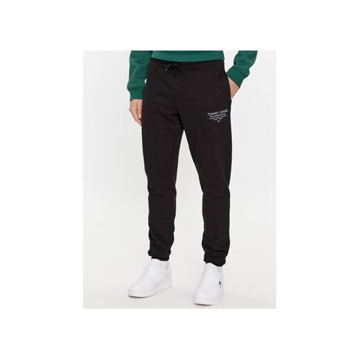 Tommy Jeans Spodnie dresowe Entry Graphic DM0DM18357 Czarny Slim Fit ze sklepu MODIVO w kategorii Spodnie męskie - zdjęcie 168526516