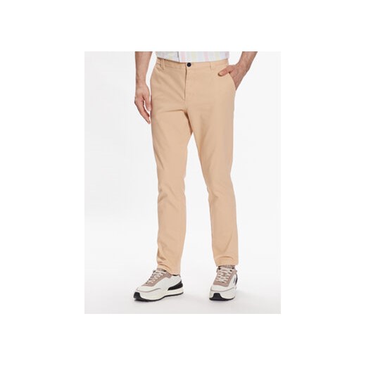 Tommy Jeans Spodnie materiałowe Austin DM0DM15964 Beżowy Slim Fit ze sklepu MODIVO w kategorii Spodnie męskie - zdjęcie 168528236