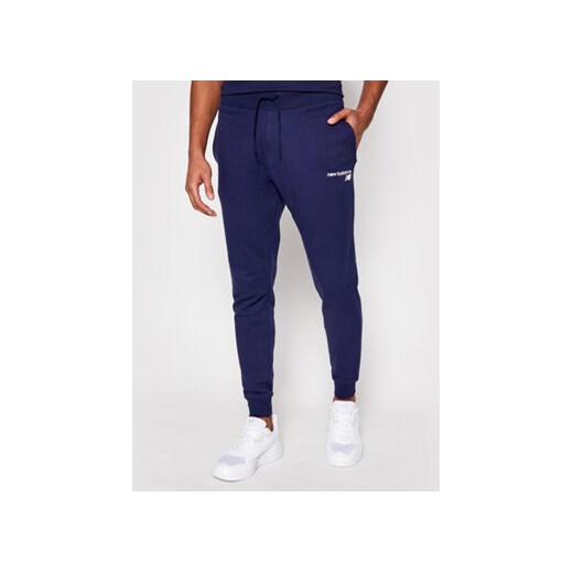 New Balance Spodnie dresowe C C F Pant MP03904 Granatowy Athletic Fit ze sklepu MODIVO w kategorii Spodnie męskie - zdjęcie 168555967