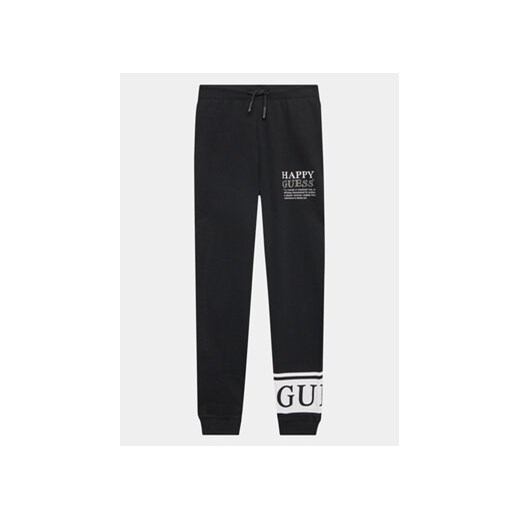 Guess Spodnie dresowe J3YQ11 KA6R4 Czarny Relaxed Fit ze sklepu MODIVO w kategorii Spodnie chłopięce - zdjęcie 168579467