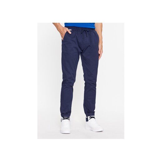 Tommy Jeans Spodnie materiałowe Scanton DM0DM17679 Granatowy Slim Fit ze sklepu MODIVO w kategorii Spodnie męskie - zdjęcie 168583417