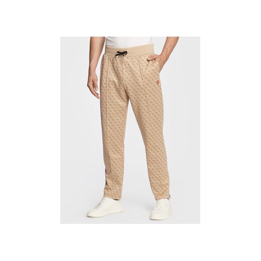 Guess Spodnie dresowe Korbin Z2BB05 FL04Q Beżowy Regular Fit ze sklepu MODIVO w kategorii Spodnie męskie - zdjęcie 168588747
