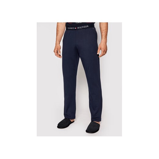 Tommy Hilfiger Spodnie dresowe UM0UM01186 Granatowy Regular Fit ze sklepu MODIVO w kategorii Spodnie męskie - zdjęcie 168592579