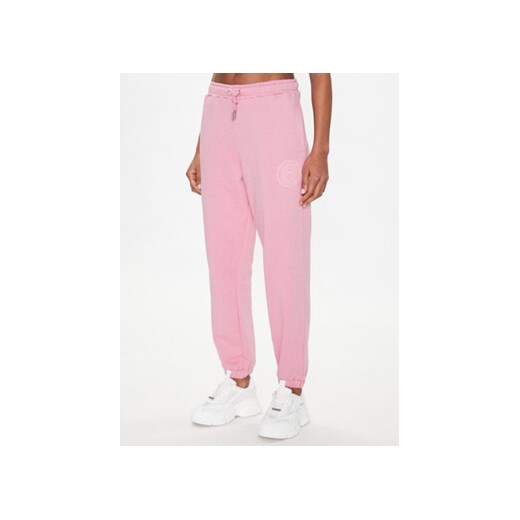 Ellesse Spodnie dresowe Jigono SGR17954 Różowy Regular Fit ze sklepu MODIVO w kategorii Spodnie damskie - zdjęcie 168595066