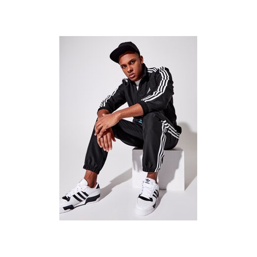 adidas Dres Essential GK9950 Czarny Regular Fit ze sklepu MODIVO w kategorii Dresy męskie - zdjęcie 168595595