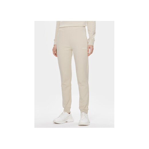 Calvin Klein Spodnie dresowe Micro Logo Essential K20K204424 Beżowy Slim Fit ze sklepu MODIVO w kategorii Spodnie damskie - zdjęcie 168597279