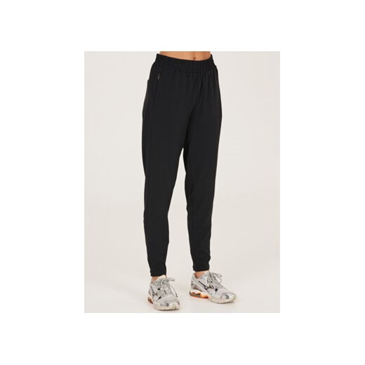 Athlecia Spodnie dresowe Timmie W Pants EA221212 Czarny Regular Fit ze sklepu MODIVO w kategorii Spodnie damskie - zdjęcie 168610015