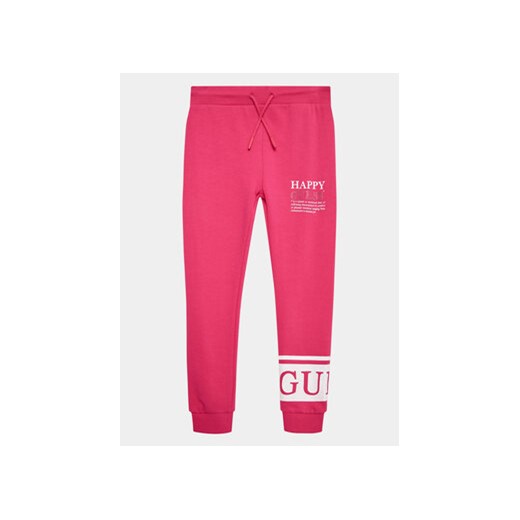 Guess Spodnie dresowe J3YQ11 KA6R4 Różowy Relaxed Fit ze sklepu MODIVO w kategorii Spodnie dziewczęce - zdjęcie 168612477
