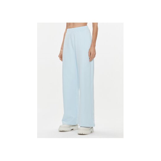 Calvin Klein Jeans Spodnie dresowe J20J222597 Niebieski Relaxed Fit ze sklepu MODIVO w kategorii Spodnie damskie - zdjęcie 168631495