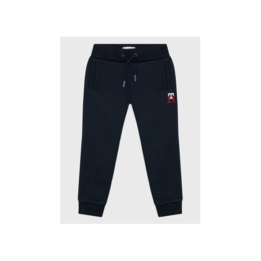 Tommy Hilfiger Spodnie dresowe Monogram KS0KS00297 Granatowy Regular Fit ze sklepu MODIVO w kategorii Spodnie chłopięce - zdjęcie 168632339