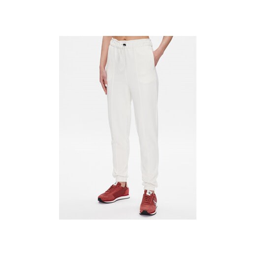 Calvin Klein Performance Spodnie dresowe 00GWS3P605 Biały Regular Fit ze sklepu MODIVO w kategorii Spodnie damskie - zdjęcie 168634658