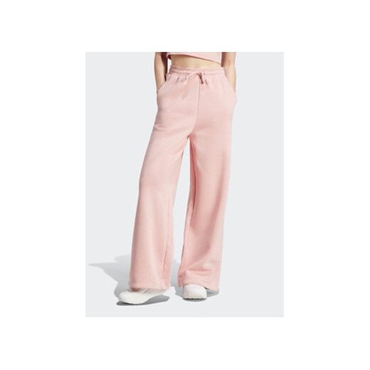 adidas Spodnie dresowe IR8378 Różowy Loose Fit ze sklepu MODIVO w kategorii Spodnie damskie - zdjęcie 168642565