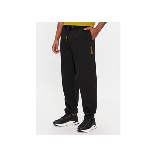 Calvin Klein Spodnie dresowe Grid Logo K10K112430 Czarny Relaxed Fit ze sklepu MODIVO w kategorii Spodnie męskie - zdjęcie 168644207