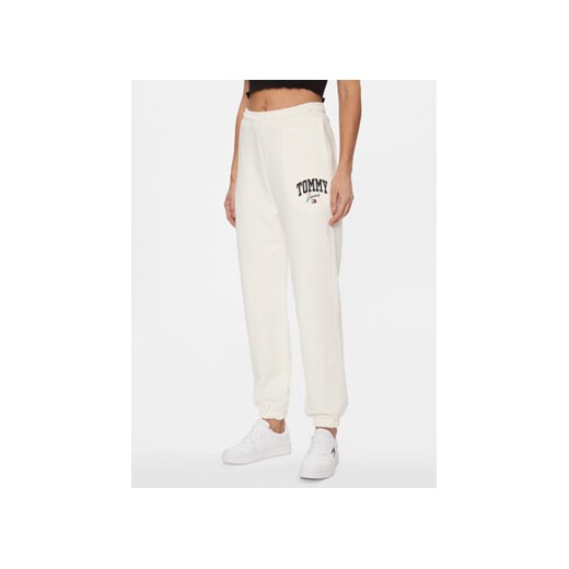 Tommy Jeans Spodnie dresowe New Varisty DW0DW16379 Biały Relaxed Fit ze sklepu MODIVO w kategorii Spodnie damskie - zdjęcie 168644515