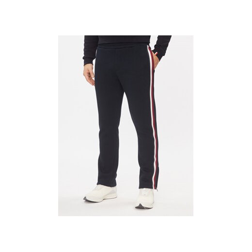 Tommy Hilfiger Spodnie dresowe Bold Global Stripe MW0MW32677 Granatowy Regular Fit ze sklepu MODIVO w kategorii Spodnie męskie - zdjęcie 168649066