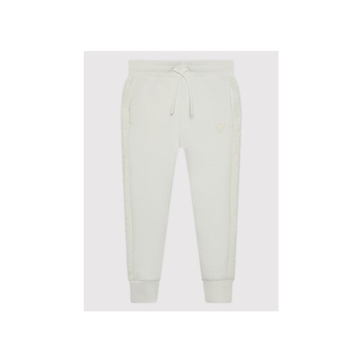 Guess Spodnie dresowe J2YQ24 FL03S Biały Regular Fit ze sklepu MODIVO w kategorii Spodnie dziewczęce - zdjęcie 168650129