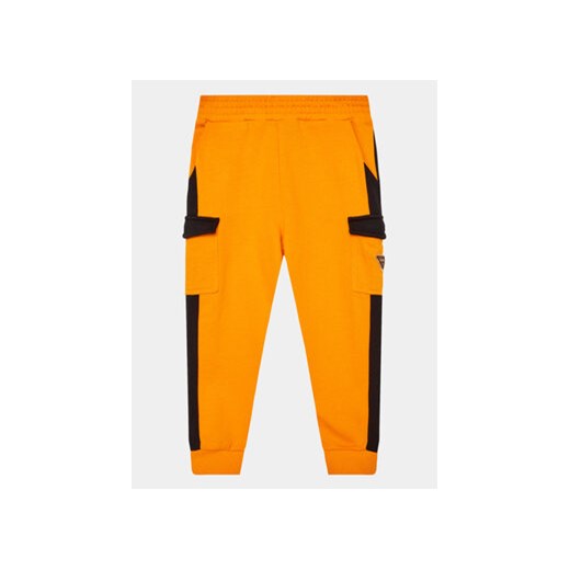 Guess Spodnie dresowe N3YQ12 KA6R3 Pomarańczowy Regular Fit ze sklepu MODIVO w kategorii Spodnie chłopięce - zdjęcie 168652695