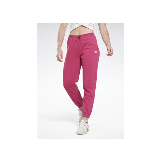 Reebok Spodnie dresowe Identity H54768 Różowy Regular Fit ze sklepu MODIVO w kategorii Spodnie damskie - zdjęcie 168653706