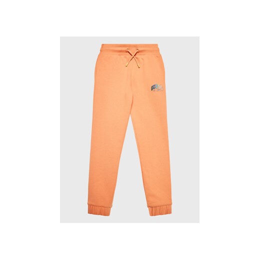 Guess Spodnie dresowe J3RQ11 KA6R0 Pomarańczowy Regular Fit ze sklepu MODIVO w kategorii Buty sportowe dziecięce - zdjęcie 168655969
