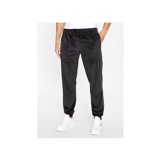 Tommy Hilfiger Spodnie dresowe UM0UM03014 Czarny Regular Fit ze sklepu MODIVO w kategorii Spodnie męskie - zdjęcie 168676139