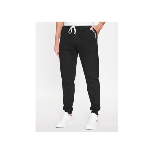 Tommy Hilfiger Spodnie dresowe UM0UM03097 Czarny Regular Fit ze sklepu MODIVO w kategorii Spodnie męskie - zdjęcie 168734247