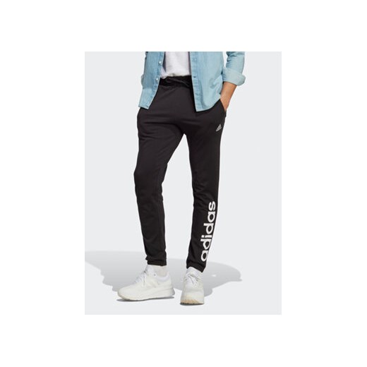 adidas Spodnie dresowe Essentials Single Jersey Tapered Elasticized Cuff Logo Joggers IC0055 Czarny Regular Fit ze sklepu MODIVO w kategorii Spodnie męskie - zdjęcie 168820287