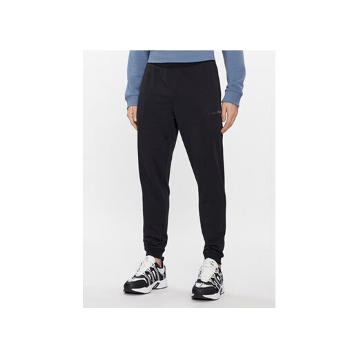 Calvin Klein Performance Spodnie dresowe 00GMS4P634 Czarny Regular Fit ze sklepu MODIVO w kategorii Spodnie męskie - zdjęcie 168827148