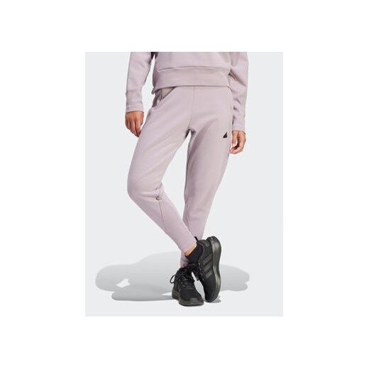 adidas Spodnie dresowe Z.N.E. Winterized IS4334 Fioletowy Regular Fit ze sklepu MODIVO w kategorii Spodnie damskie - zdjęcie 168839179