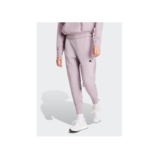 adidas Spodnie dresowe Z.N.E. IS3913 Fioletowy Regular Fit ze sklepu MODIVO w kategorii Spodnie damskie - zdjęcie 168854799