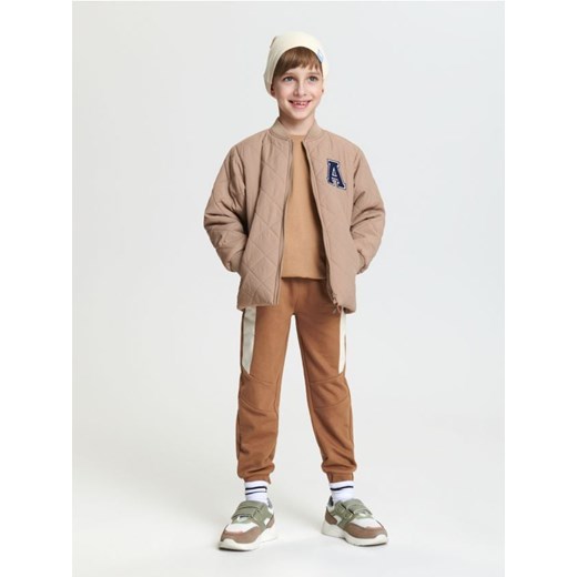 Sinsay - Spodnie dresowe jogger - beżowy ze sklepu Sinsay w kategorii Spodnie chłopięce - zdjęcie 169092776